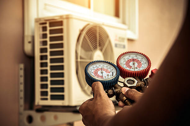 Professional Air Conditioning Service technician working in Summit Point, WV